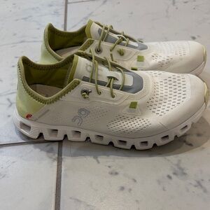 On Clouds White and Green Athletic Shoes